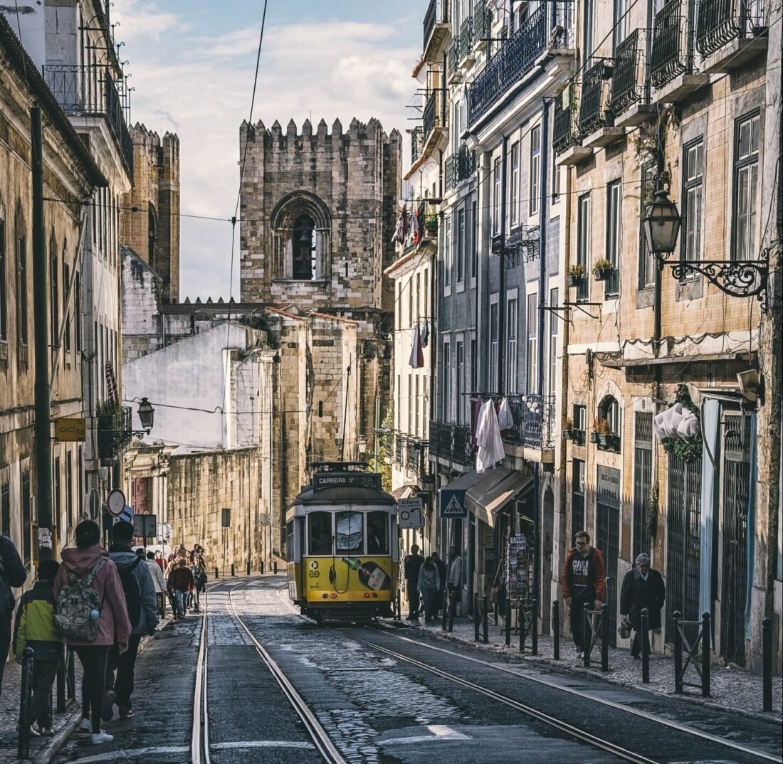 A tram on a narrow street in Lisbon's Alfama district.