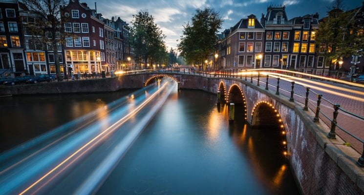 time lapse over a canal in Amsterdam at night