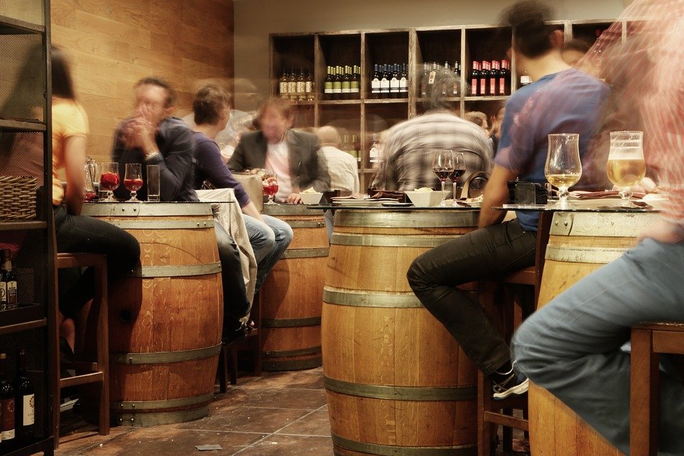 People eating and drinking wine at a tapas show in Barcelona