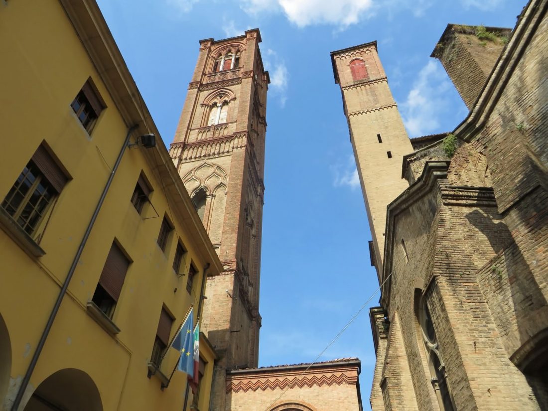 Two towers in Bologna Italy viewed from below.