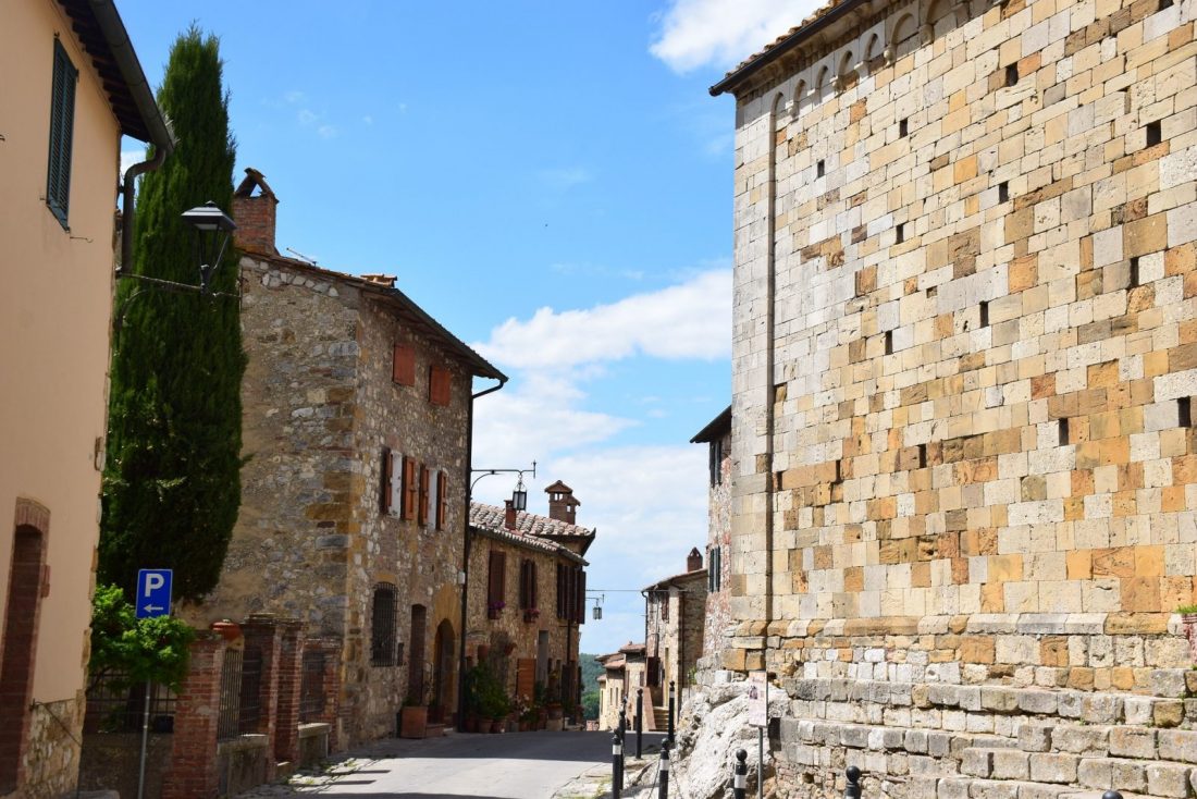 A street and stone buildings in Cortona Italy