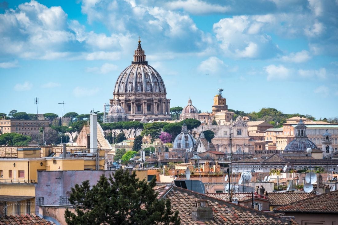 a view of the Vatican and the rooftops of Rome