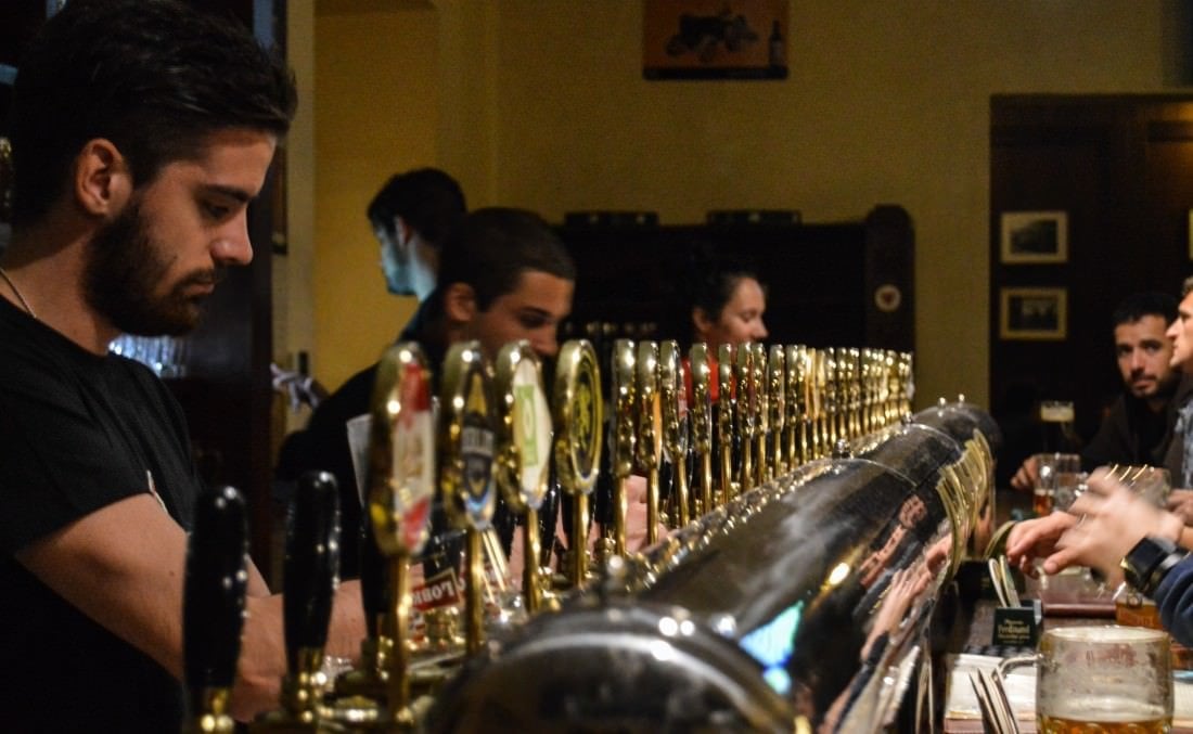 bartenders pouring beer at the prague beer museum in Namesti Miru