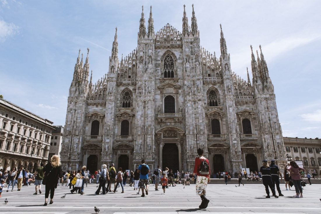 The people walking in front of the cathedral in Milan, Italy