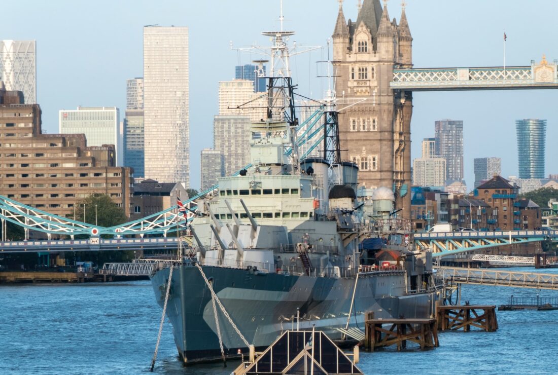 The HMS Belfast warship with Tower Bridge in the background in London. 